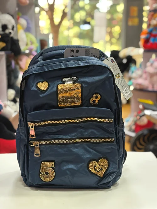 کوله‌پشتی فانتزی دخترانه با طرح پولکی طلایی و زیپ فلزی – مناسب مدرسه و روزمره